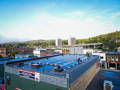 rooftop of the frost river store covered in solar panels with the duluth hillside in the background