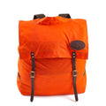 The Hunter Orage Box Utility Pack is made from durable waxed canvas, premium leather, and solid brass.