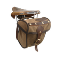 The Eco Trail Seat Bag is crafted out our high quality waxed canvas, high grade premium leather, and durable solid brass. A leather strap with a brass buckle keeps this bag shut.